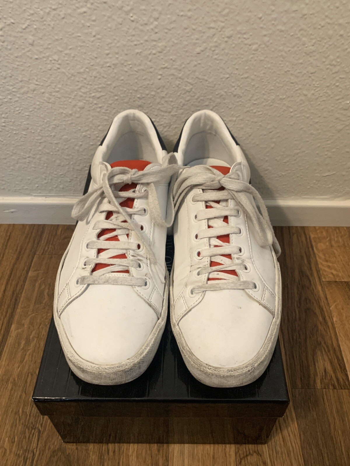 red and white tennis shoes