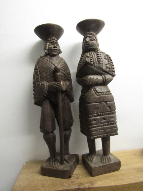 Pair of South American antique carved Indian figures (male/female) 12 1/2" tall.