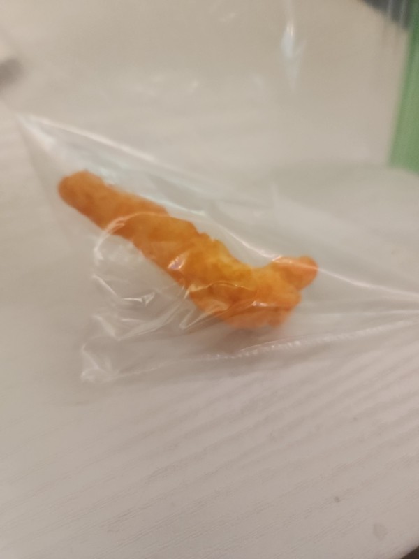 cheeto (kinda) shaped like Chester paw