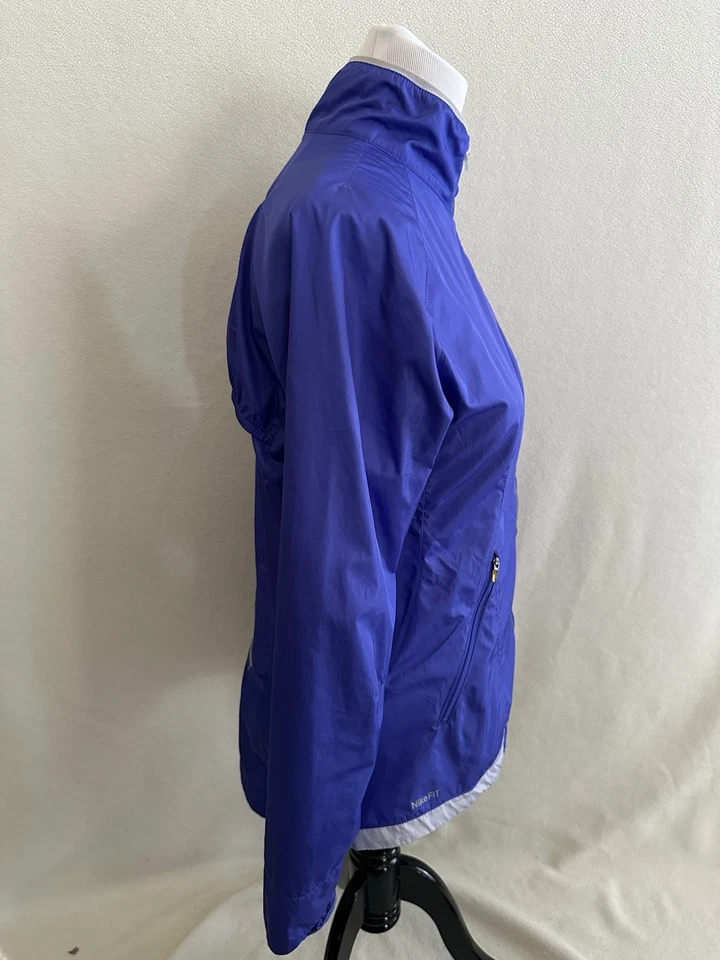 Chaqueta cortavientos Nike Storm-Fit para mujer azul medio cremallera completa bolsillos con cremallera Foto 4 de 4