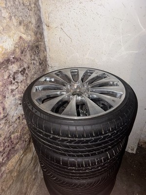 Silver 22 Inch Rims With Tires. One Tire Does Have A Slow Leak