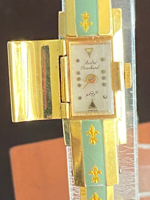 VINTAGE LADIES ANDRE BOUCHARD HOODED CUFF WRIST WATCH, KEEPING TIME,FLEUR DE LIS