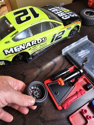 RC tire wheel balancer adapter for Losi Nascar wheels, the orange part pictured