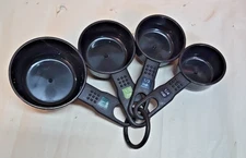 Set of (4) Black Plastic Round Farberware Measuring Cups