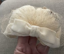 Vintage Feathered Fascinator Hat With Birdcage Veil And Velvet Bow. 1950 s.