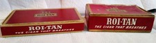 Two Vintage Roi-Tan pressboard cigar boxes with "The Cigar That Breathes" slogan
