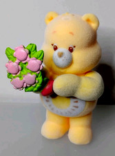 Care Bears Funshine Bear Flocked 2.5" Figure Holding Pink Flower Bouquet