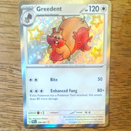 The Pokémon Company Greedent SV: Paldean Fates Shiny Rare Holo EN 206/091
