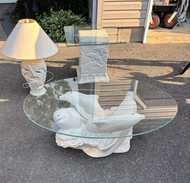 Oval Glass Top Coffee Table Dolphin Base White/Clear 45x32x16 in