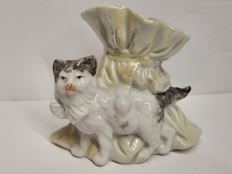 Old Ceramic Cat Figural Vase Standing By Open Drawstring Bag