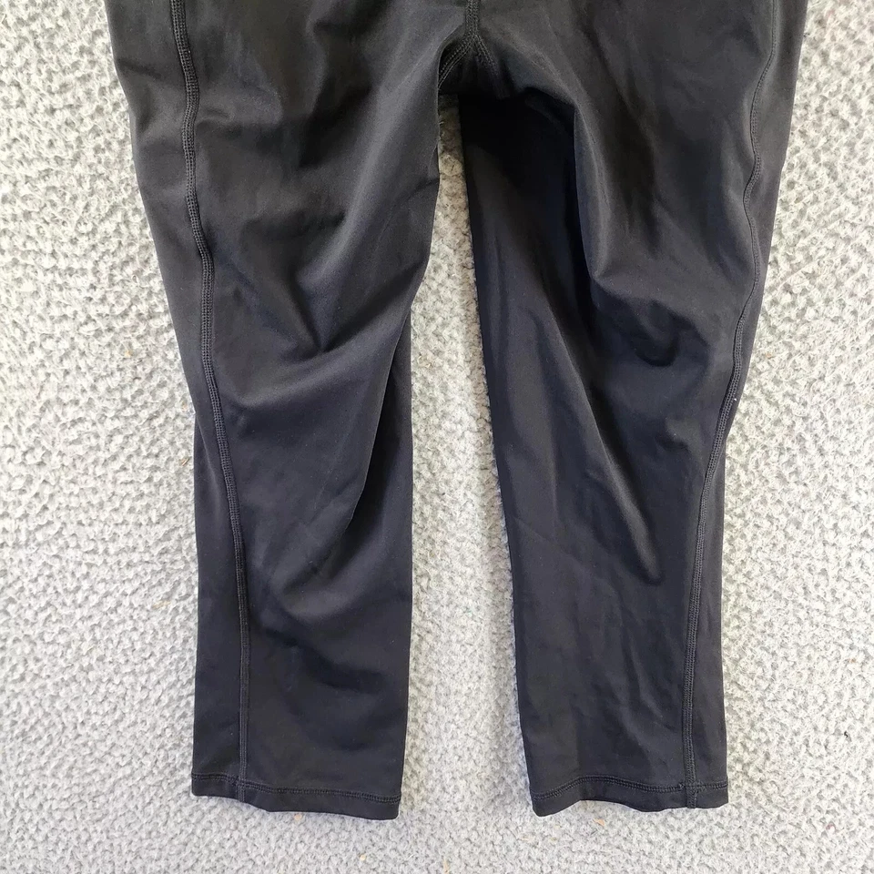 Legging corto suave ID Ideology para mujer S negro bolsillo lateral cintura elástica tirar Foto 4 de 4