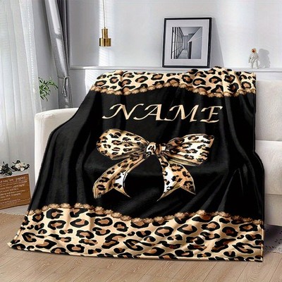 One personalized leopard print fleece blanket - name/text can be customized. 