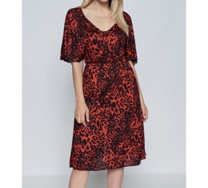 orange and black animal print dress