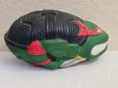 Green 1991 Mirage Studios Teenage Mutant Ninja Turtles Football Raphael with black mask and red tail.