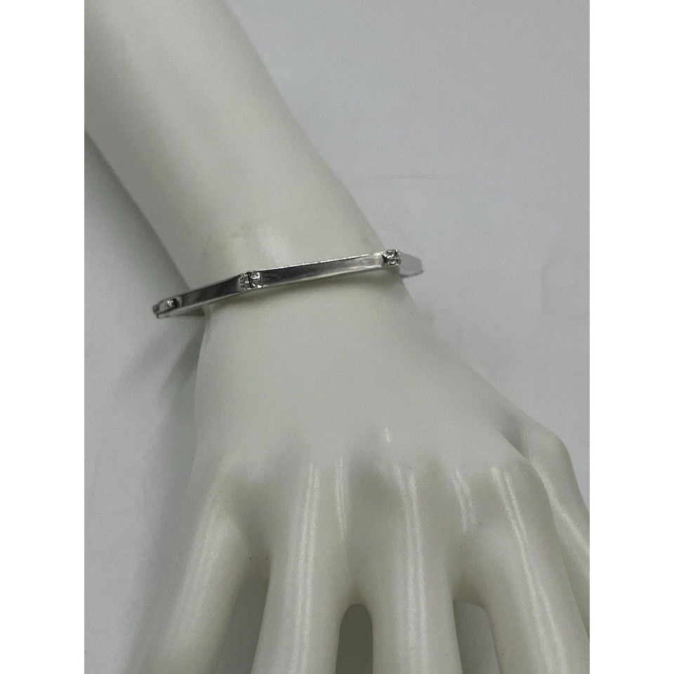 Pulsera angular con bisagras hexagonal elegante de acero inoxidable de diseño Tory Burch Foto 2 de 4