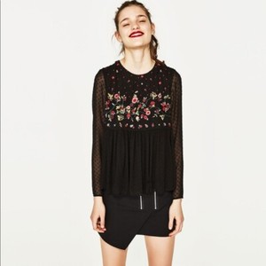 sheer black top with floral embroidery