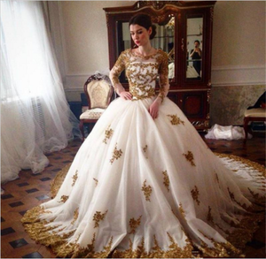 white and gold wedding dress