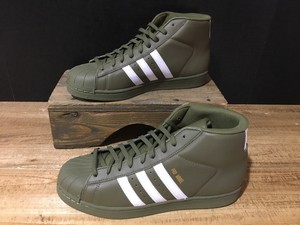 white and gold adidas high tops