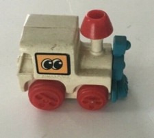TOMY LOCOMOTIVE WIND UP TRAIN 1 1/2&rdquo; COLLECTIBLE goes forward and around  works