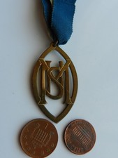 A VINTAGE UNKNOWN MEDAL w/ RIBBON.  M-S-U ?