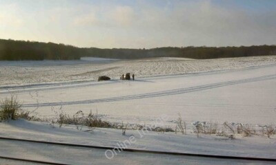 Photo 6x4 Snowy scene near Woolmer Green A car has skidded off the minor  c2009