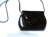 Black vinyl evening bag, V-shaped flap, snaps closed, c. 1960s