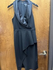 Womeen "XSCAPE" black sleeveless knee length dress.Size 8