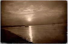 Ocean Scene with Small Boat, Curving Shoreline, 1944 RPPC Photo, Postcard