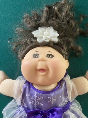 Cabbage Patch Kids Doll medium size comes with dress and hair piece. no shoes 