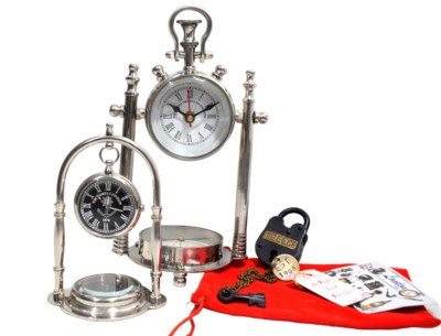 A Stunning Set of Two Nickel Clocks Adorned with Functional Compasses