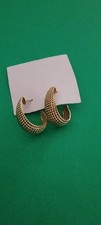 Pair of chunky, crescent-shaped gold hoop ear...