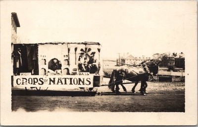 c1920s RPPC Photo Postcard PARADE SCENE / ''CROPS OF NATIONS'' Horse-Drawn Float