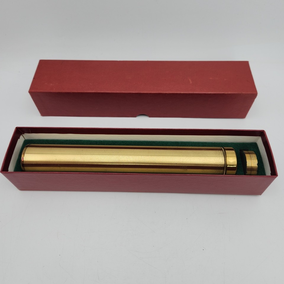 A 9.5" Van Cort brass kaleidoscope — a serious American-made optical object that's as much sculpture as toy, complete with original box.