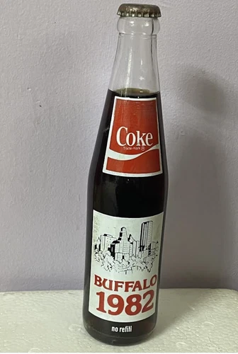 Vintage 1982 coca cola buffalo 1982 design full bottle. Antique collectable.