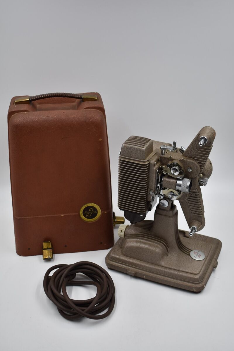 VINTAGE 8MM REVERE MODEL 85 FILM PROJECTOR, ORIGINAL CASE VINTAGE 8MM REVERE MODEL 85 FILM PROJECTOR, ORIGINAL CASE
