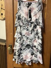 Women’s Dresses (qty 2). And Sweater. S.L. Fashions