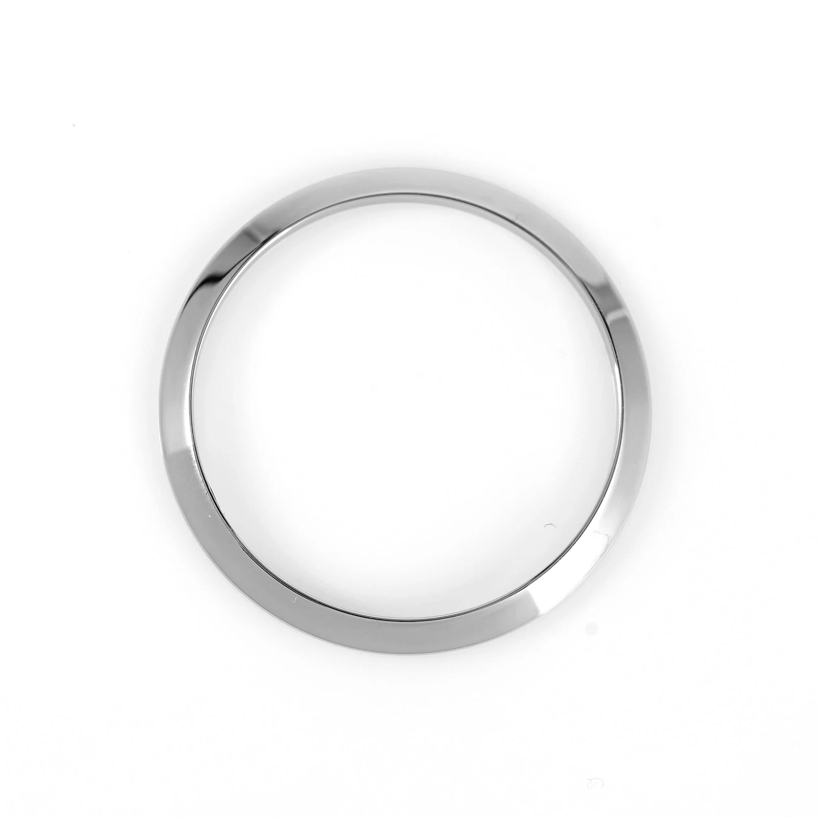 Polished stainless steel Rolex bezel with smooth finish and round shape on white background.
