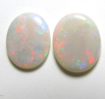 matched pair of solid white opals, 11 x 9 mm each, 2.6 carats, good color, fire