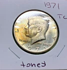 1971 Kennedy Half, light toning. Theo Challenge coin. Free S/H