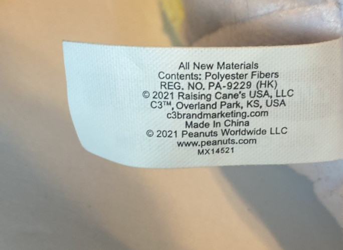 Raising Cane's Yellow Labrador dressed as snoopy Charlie brown Peanuts plush