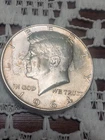 Lot of (2) Kennedy Half Dollars - 1964 (90%) & 1969 (40%) Silver