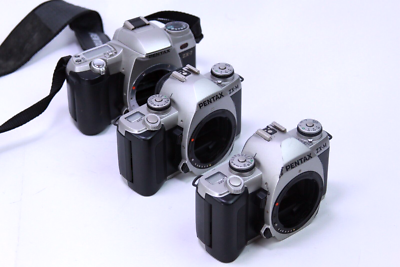 Lot of 3 Pentax ZX-M (2) & zx-7 (1) 35mm Camera bodies - Power on