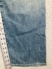 Blue stretch light wash Karen Kane women’s jeans, 6, with measuring tape across the waistband.
