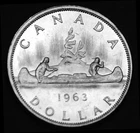 1963 $1 silver coin that is AU and in a paper flip. Gorgeous