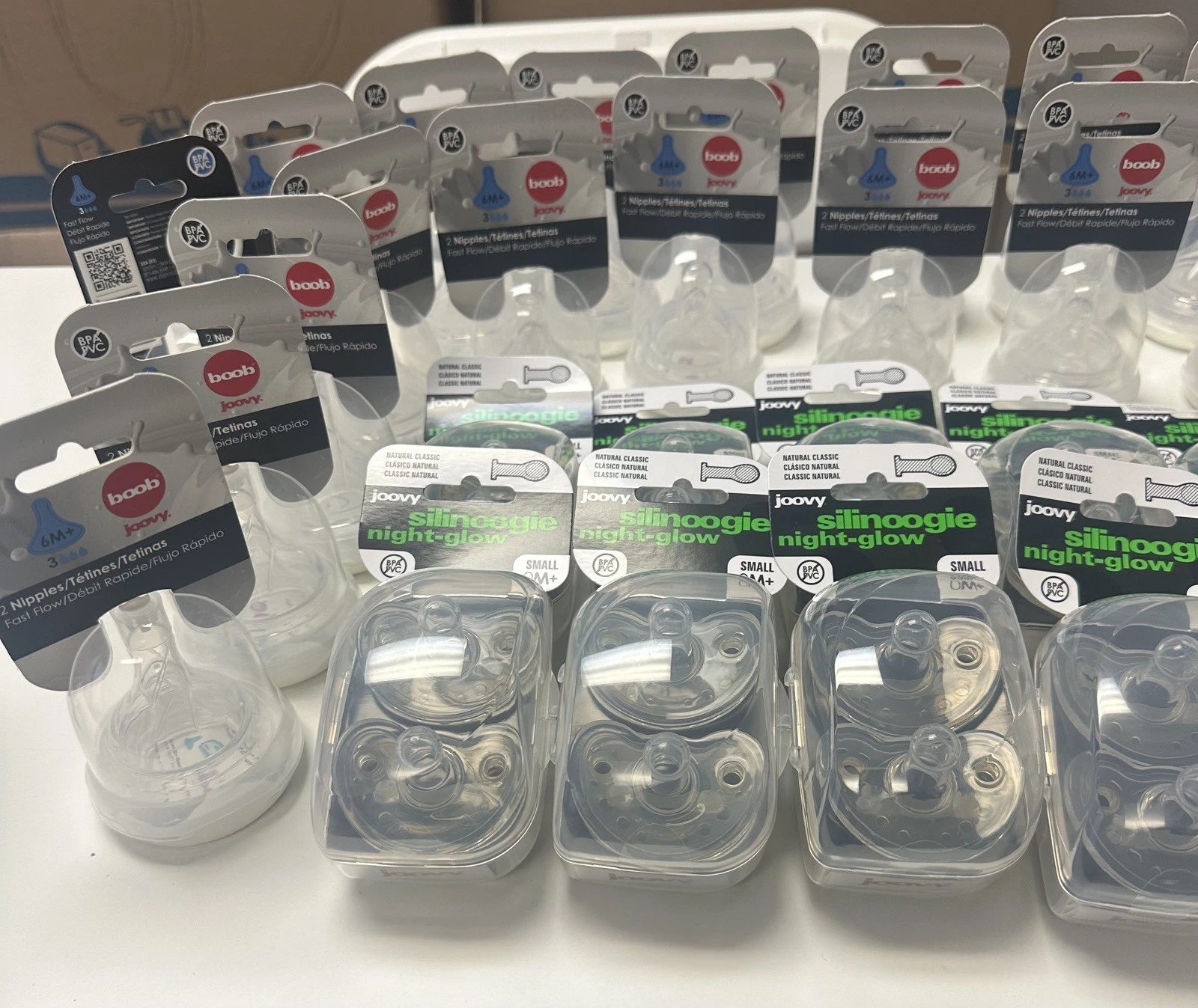 51 piece set of 24 Joovy Baby Pacifiers, 24 pack boob Joovy and 3 clear bottles