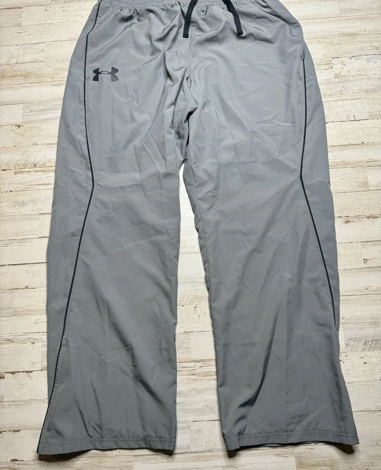 Pantalones cortavientos Under Armour para hombre XL gris forrados de malla bolsillos con cremallera pista Foto 4 de 4