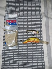 2 X Rebel Fishing Lures 1 X Floating Minnow 1 X Crawfish