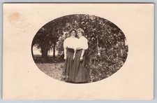 Postcard RPPC Two Young Women Standing Outside