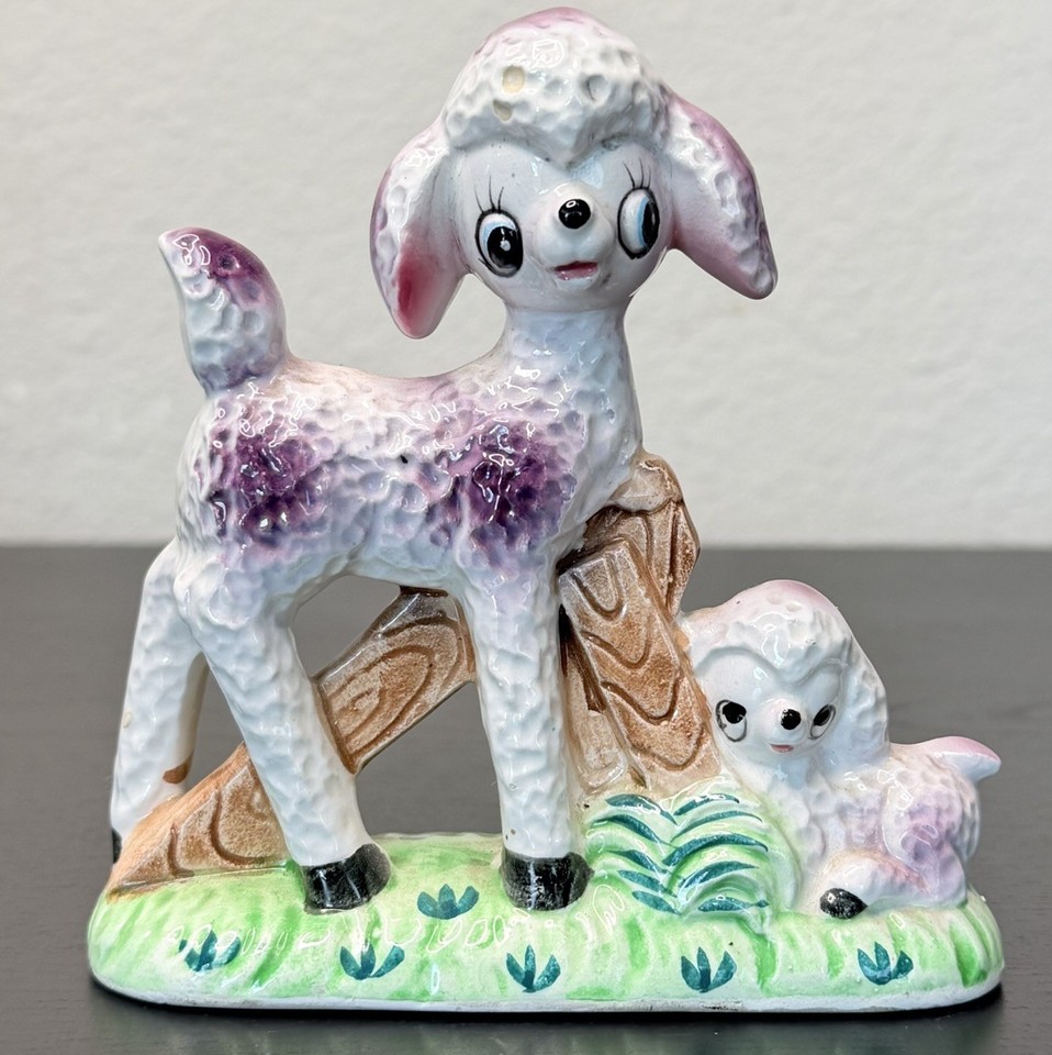 A 1950s Japan-made anthropomorphic mama-and-baby lamb duo that radiates maximum mid-century charm and absurdist cuteness.