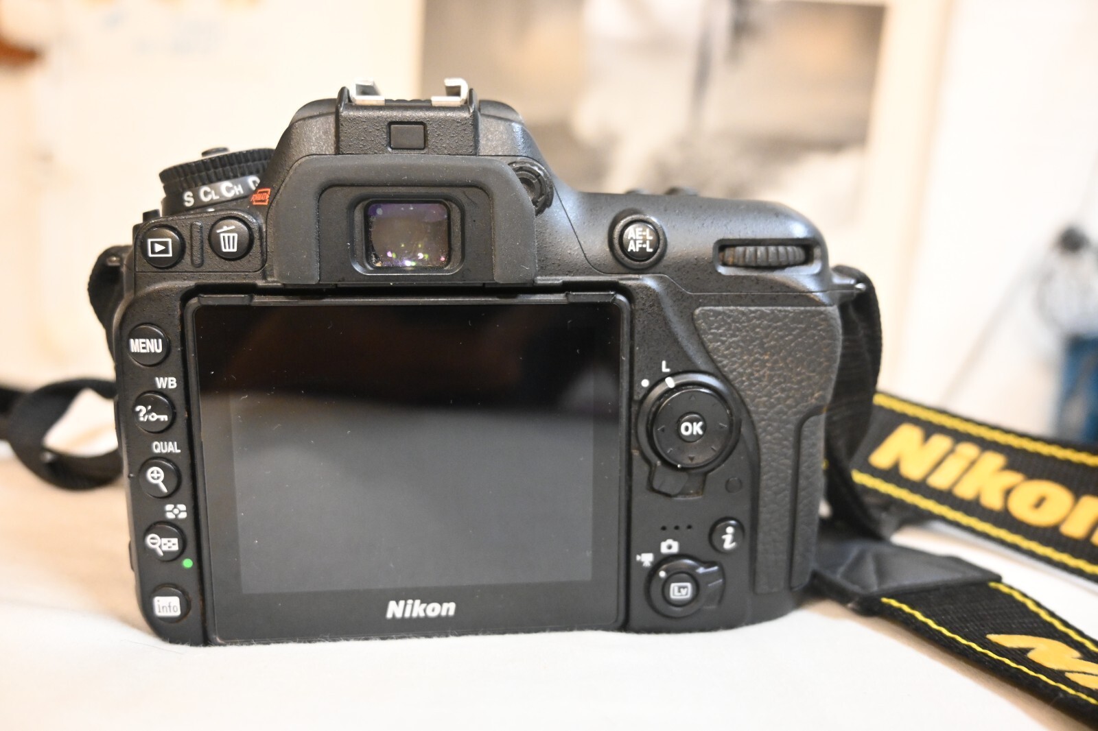 Nikon D7500 with lens, 64GB sim card, camera strap, battery, battery